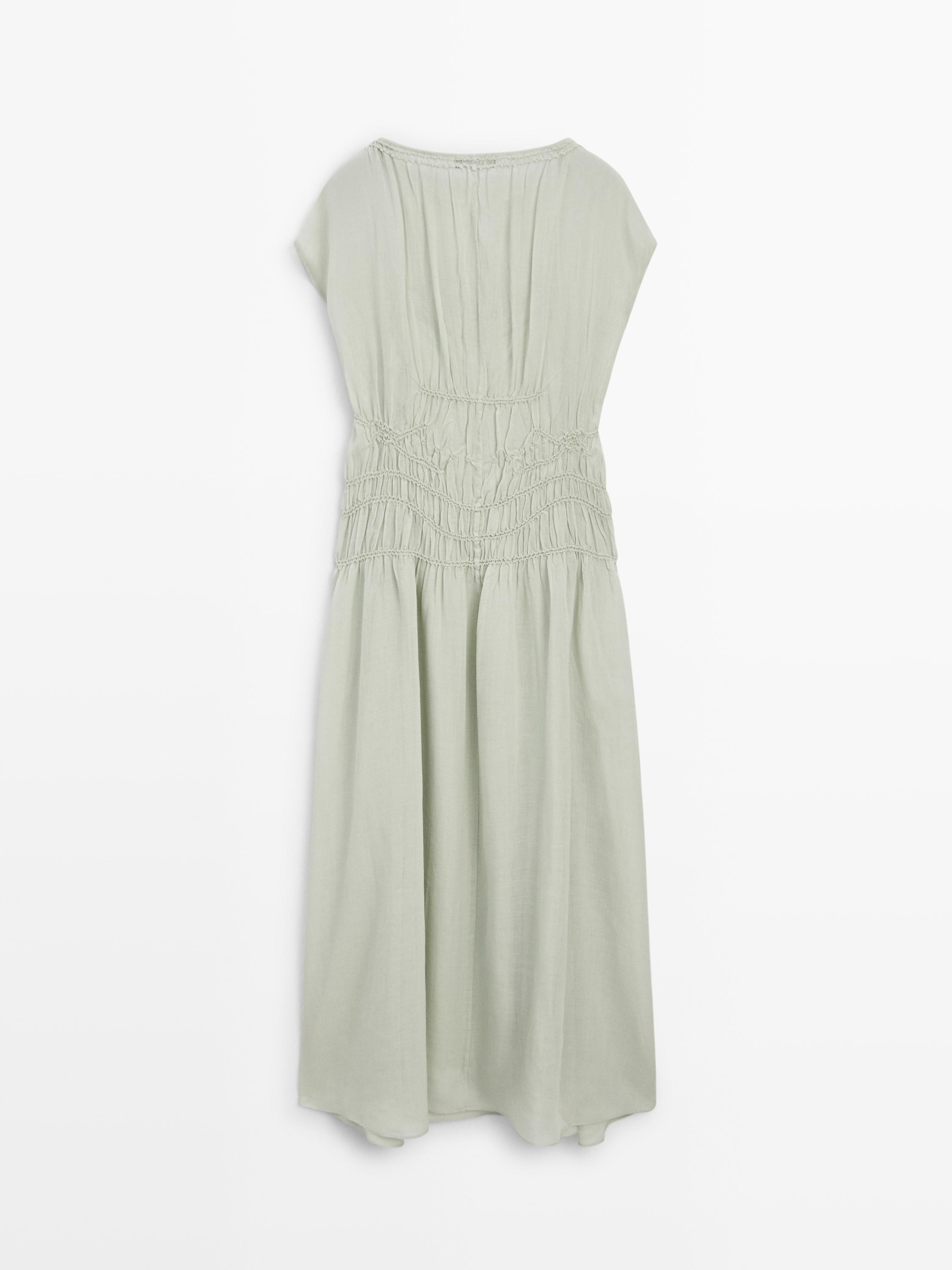 Long flowing dress with embroidered details